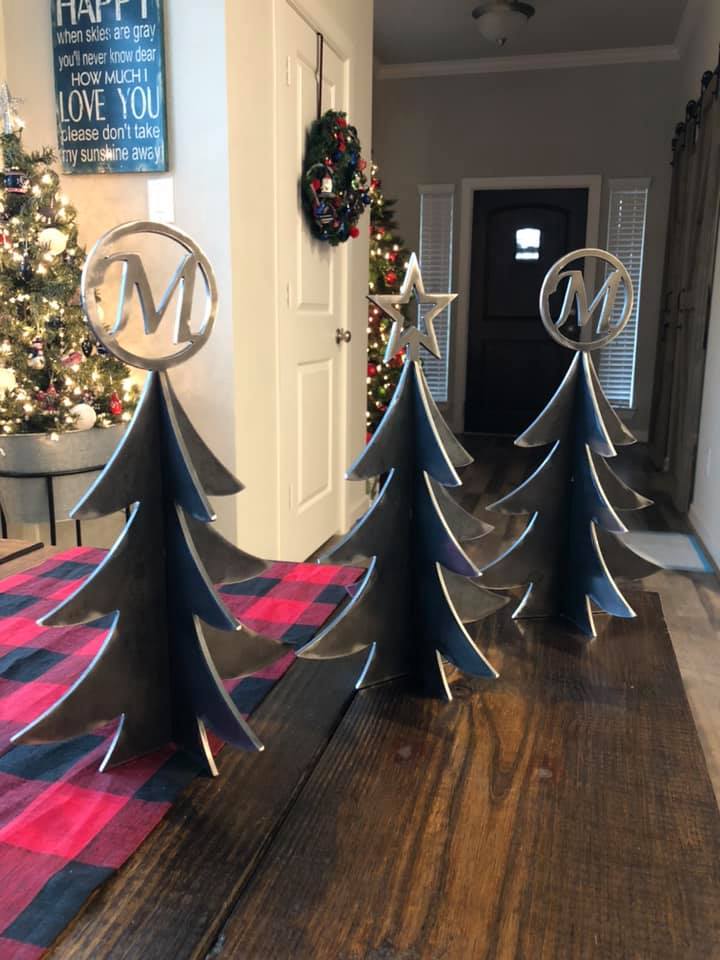 Personalized steel Christmas trees with monogram toppers